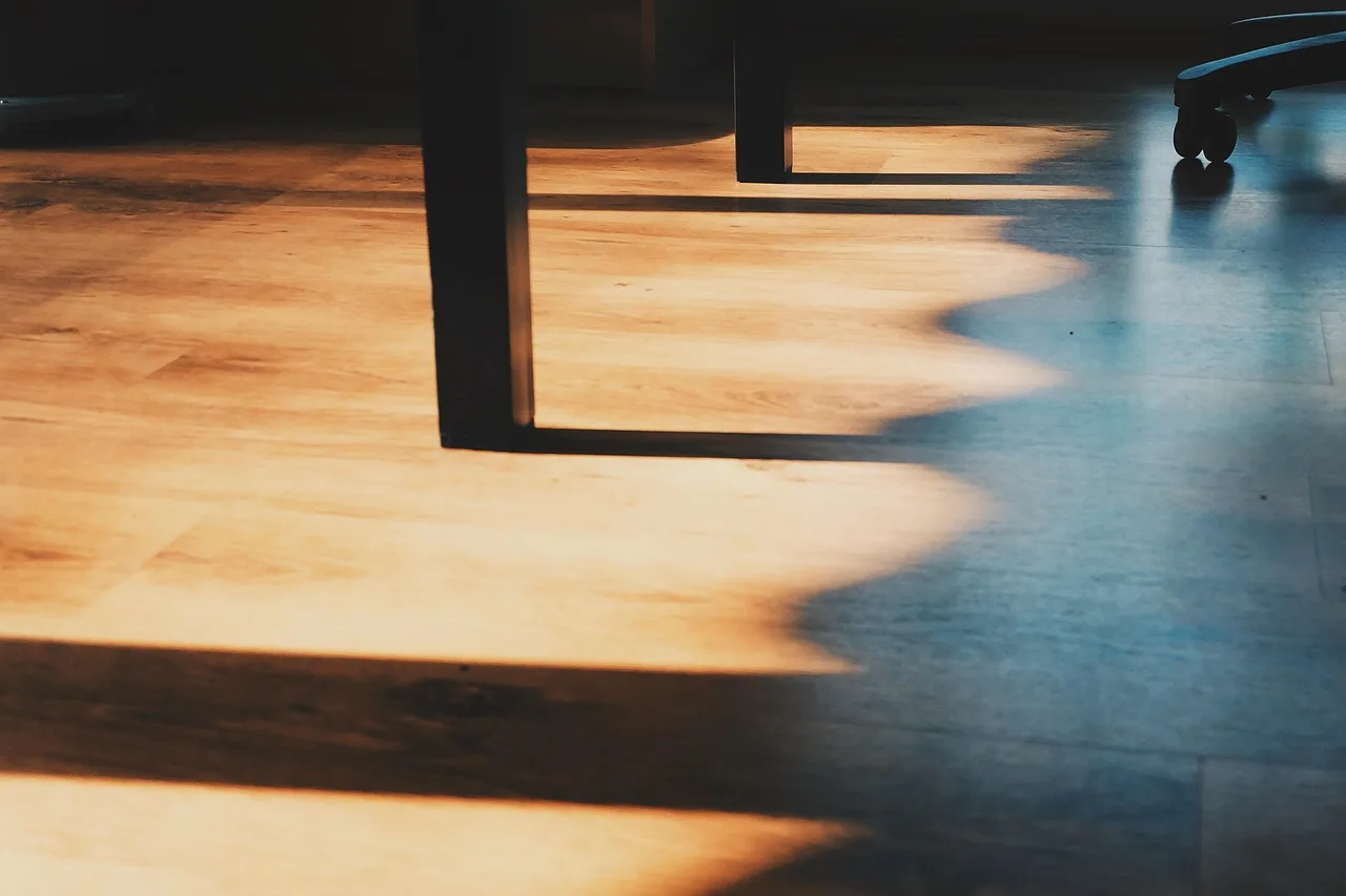 shadow cast on a hardwood floor